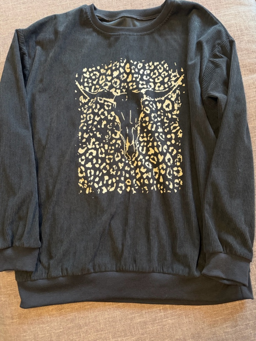 Woman’s Black Long-Sleeve Sweater with Gold Graphic